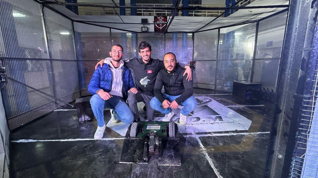 The Black Shark team in the ISIMM CYBERBOT V4 arena with their RoboClaw powered 85kg battle bot
