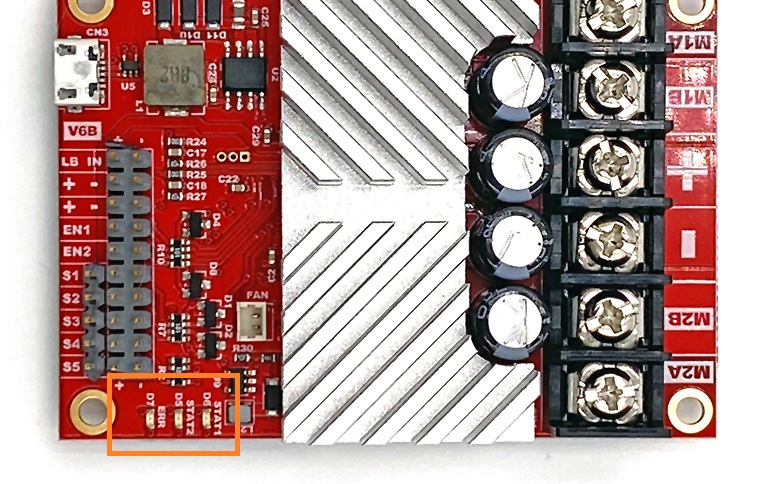 The ERR, STAT1 and STAT2 status LEDs on the edge of a RoboClaw motor controller board